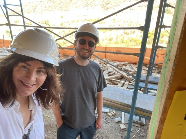 The Dolce Dimora team in hard hats on a construction site
