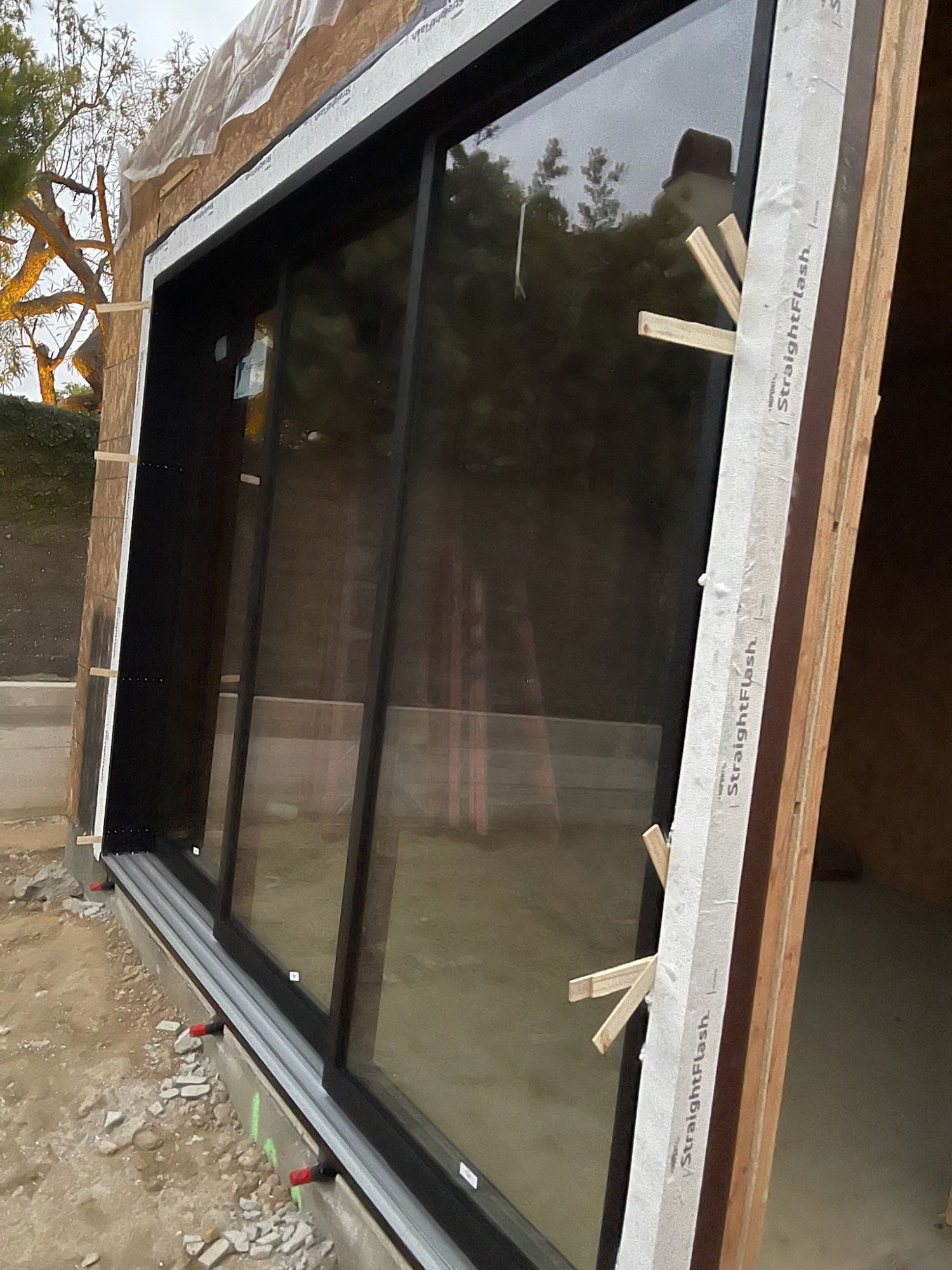 Sliding door installation with flashing